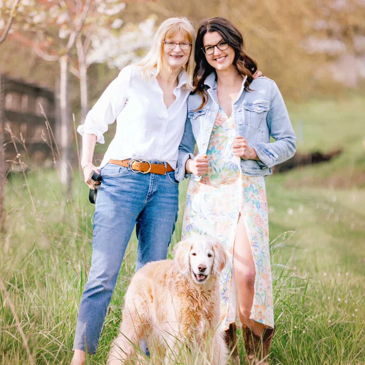 Anna and Liz Savage, the mother and daughter team who run Cottons and Blues, standing in a field with their dog